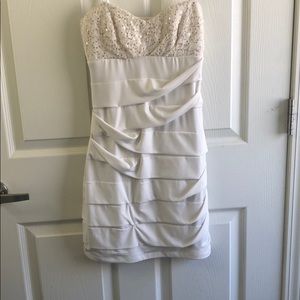 Strapless white dress with gold detail